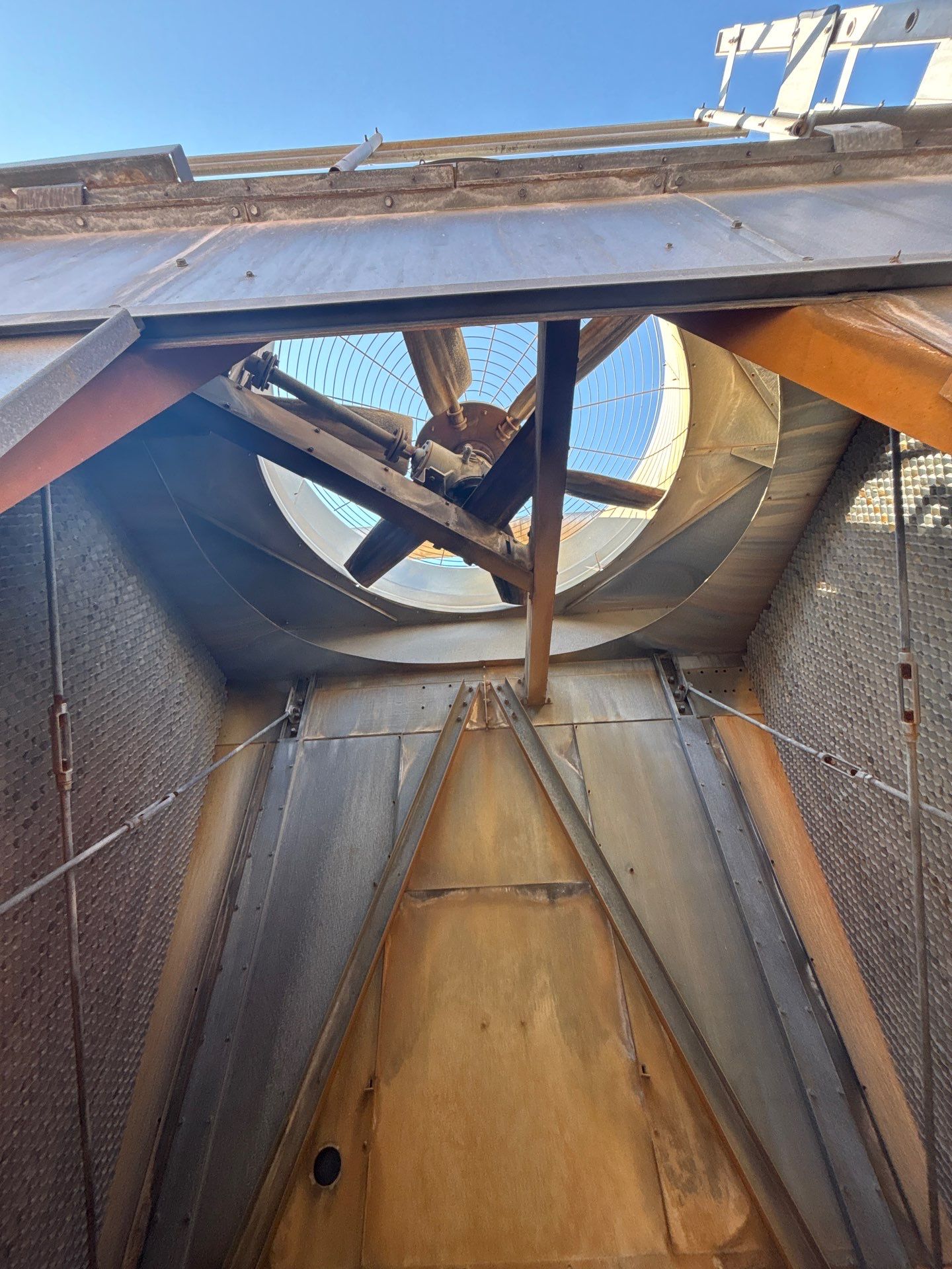 Inside a commercial cooling tower — fan stack and plenum accessed for cleaning